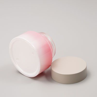 Pot de crème cosmétique en verre rose
