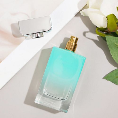 Flacon de parfum rectangulaire bleu et vert